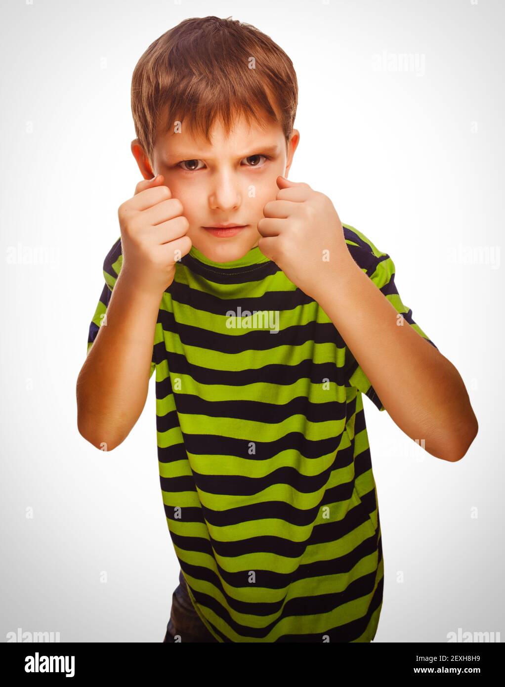 Bad child boy blond bully angry aggressive fights Stock Photo