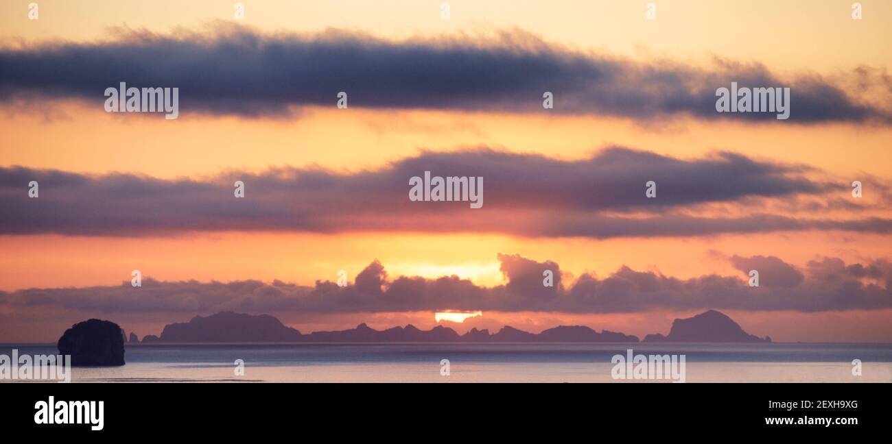 Sunrise over the Alderman Islands off the Coromandel Peninsula in New Zealand's North Island Stock Photo