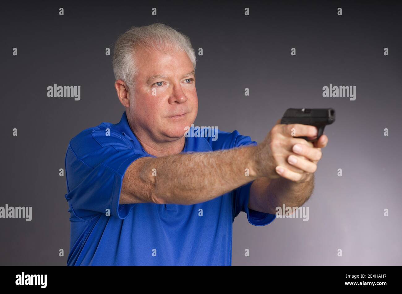 gun pointing man stock photo