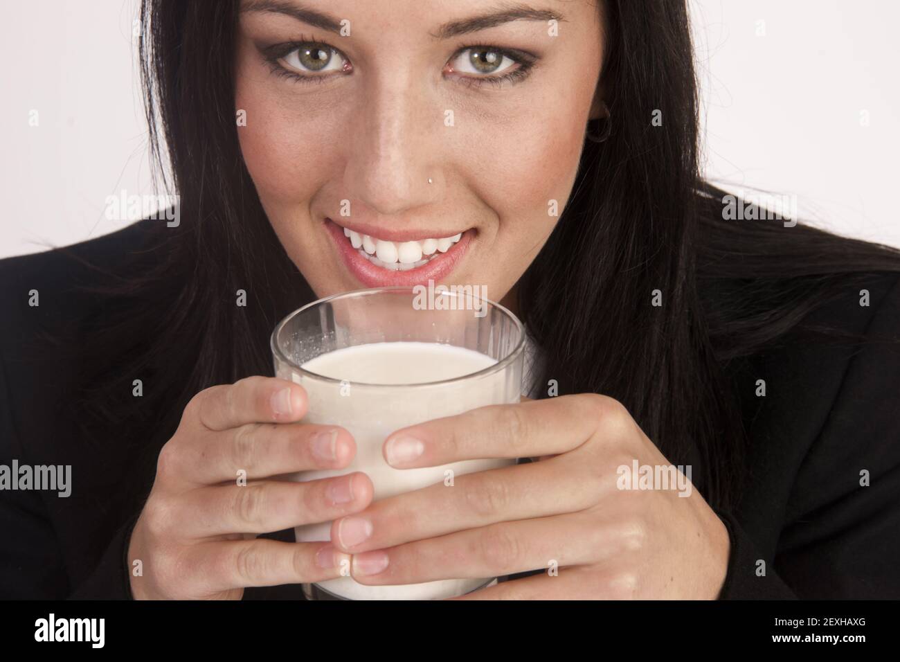 Attractive Young Woman Drinks Whole Milk From a Glass Stock Photo Alamy