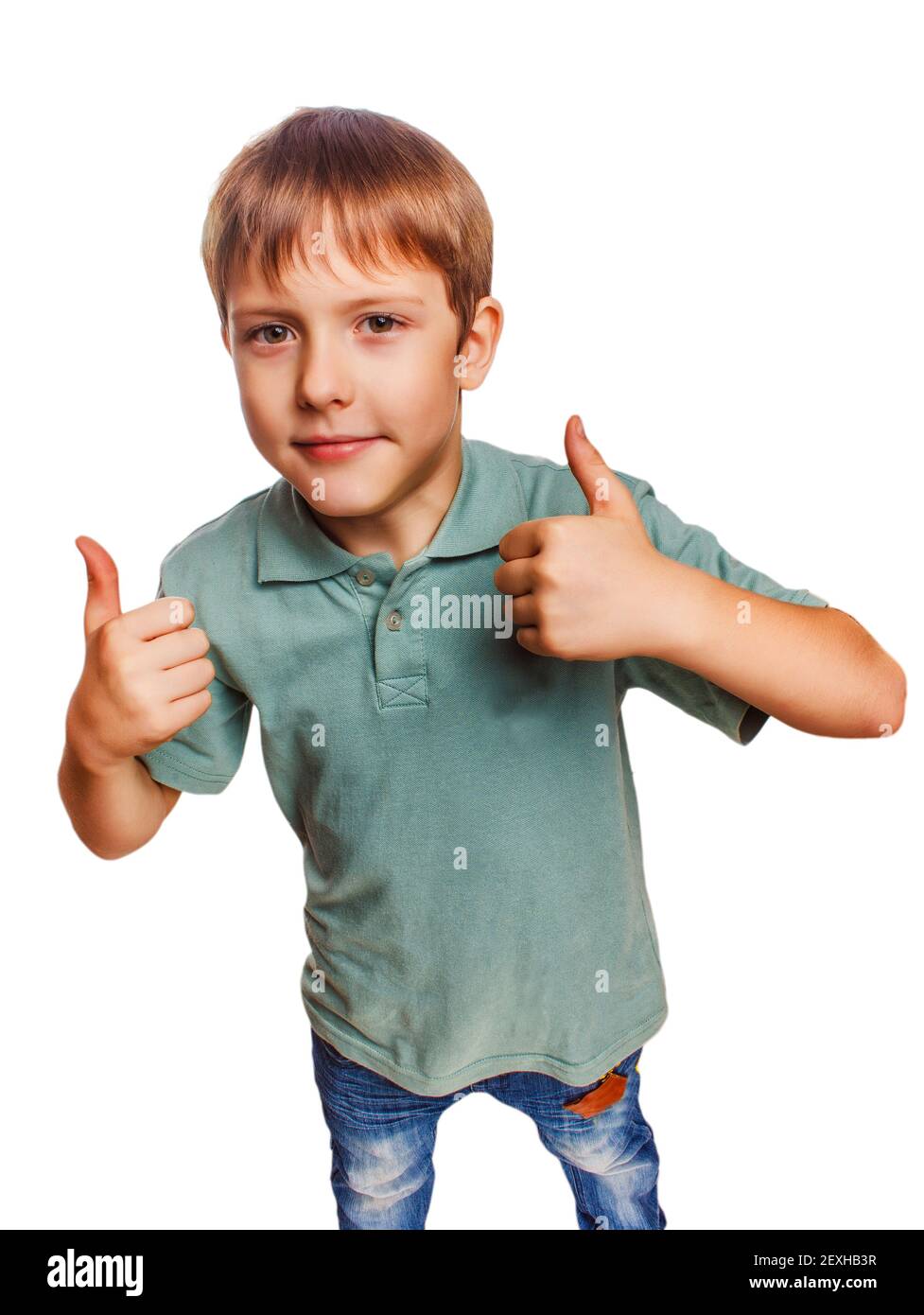 Blonde boy kid in blue shirt holding thumbs up, showing the sign Stock Photo