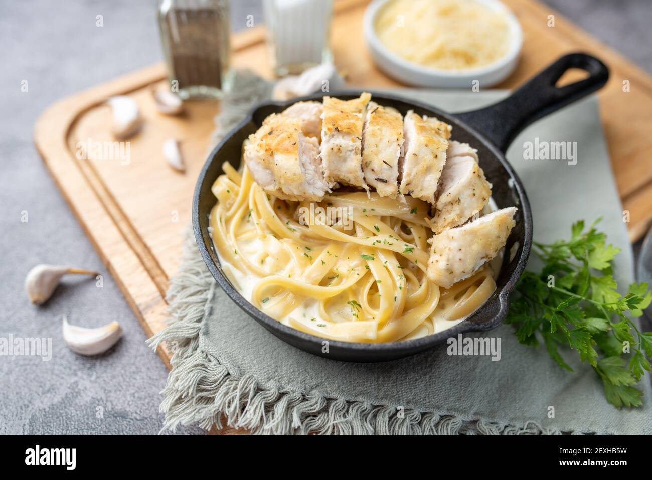Alfredo pasta dinner with creamy white sauce and herbs Stock Photo Alamy