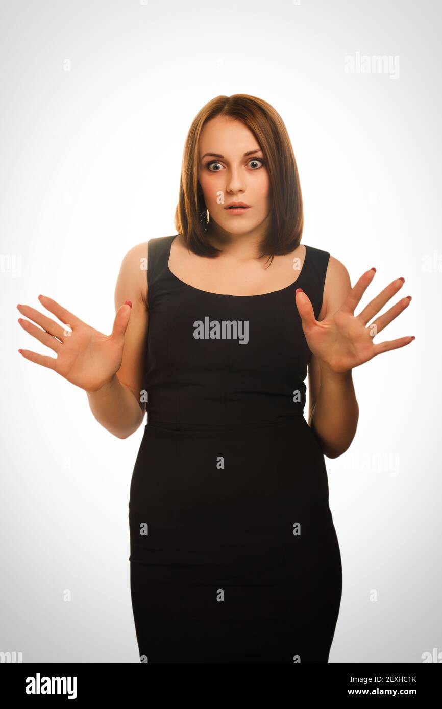 Surprised excited woman throws up his hands opened her Stock