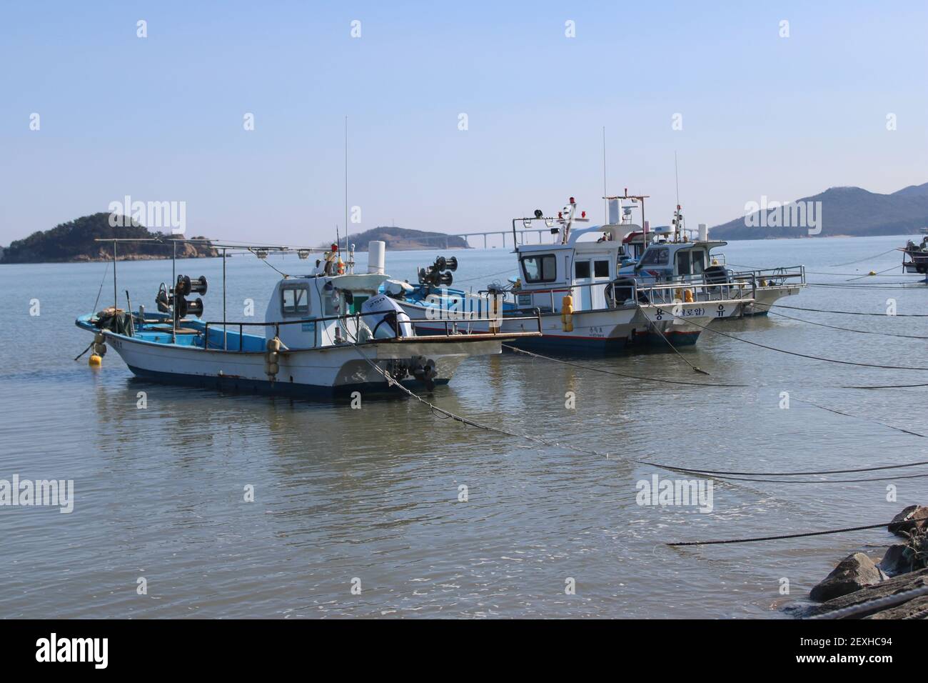 Fishing boats calmly bobbing in estuary, Incheon, Korea Stock Photo