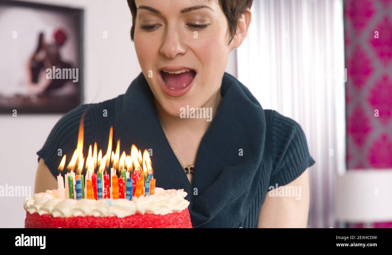 Woman blow birthday candles hires stock photography and images Alamy