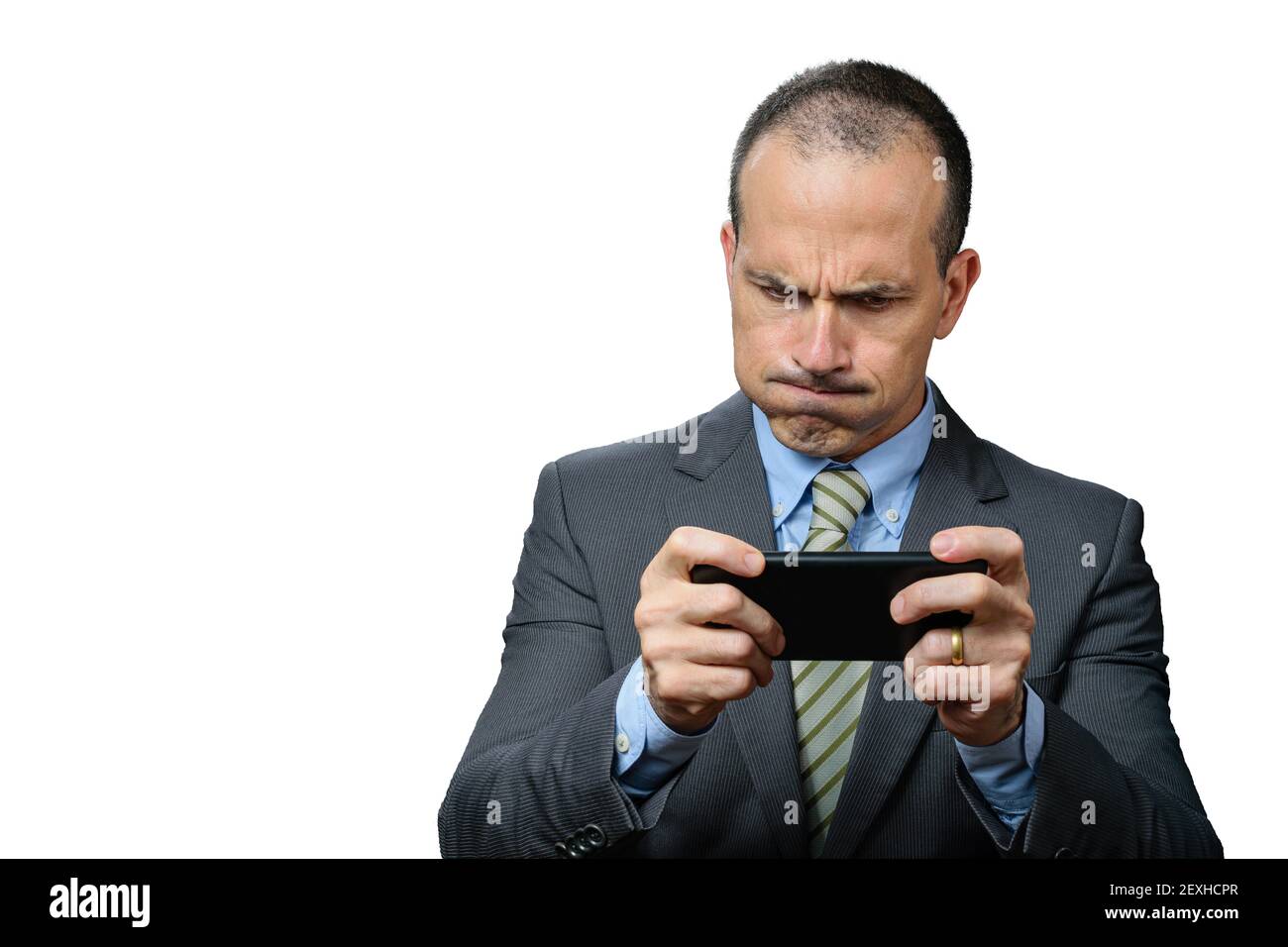 Mature man with suit and tie, playing on his smartphone and breathing through his nose. Stock Photo
