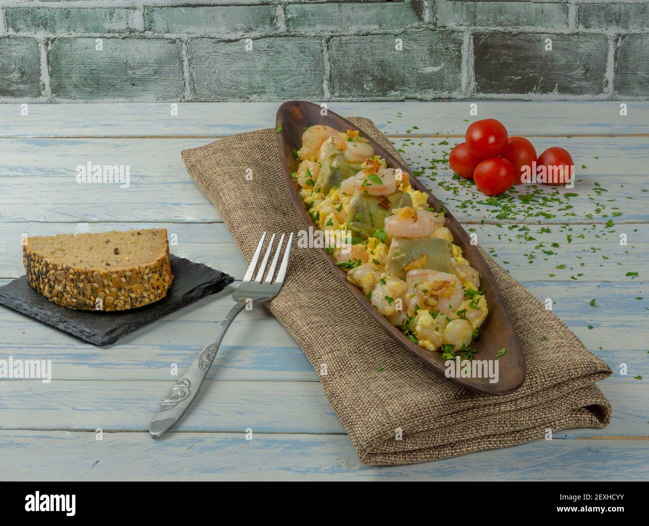 scrambled eggs with prawns and artichokes Stock Photo Alamy