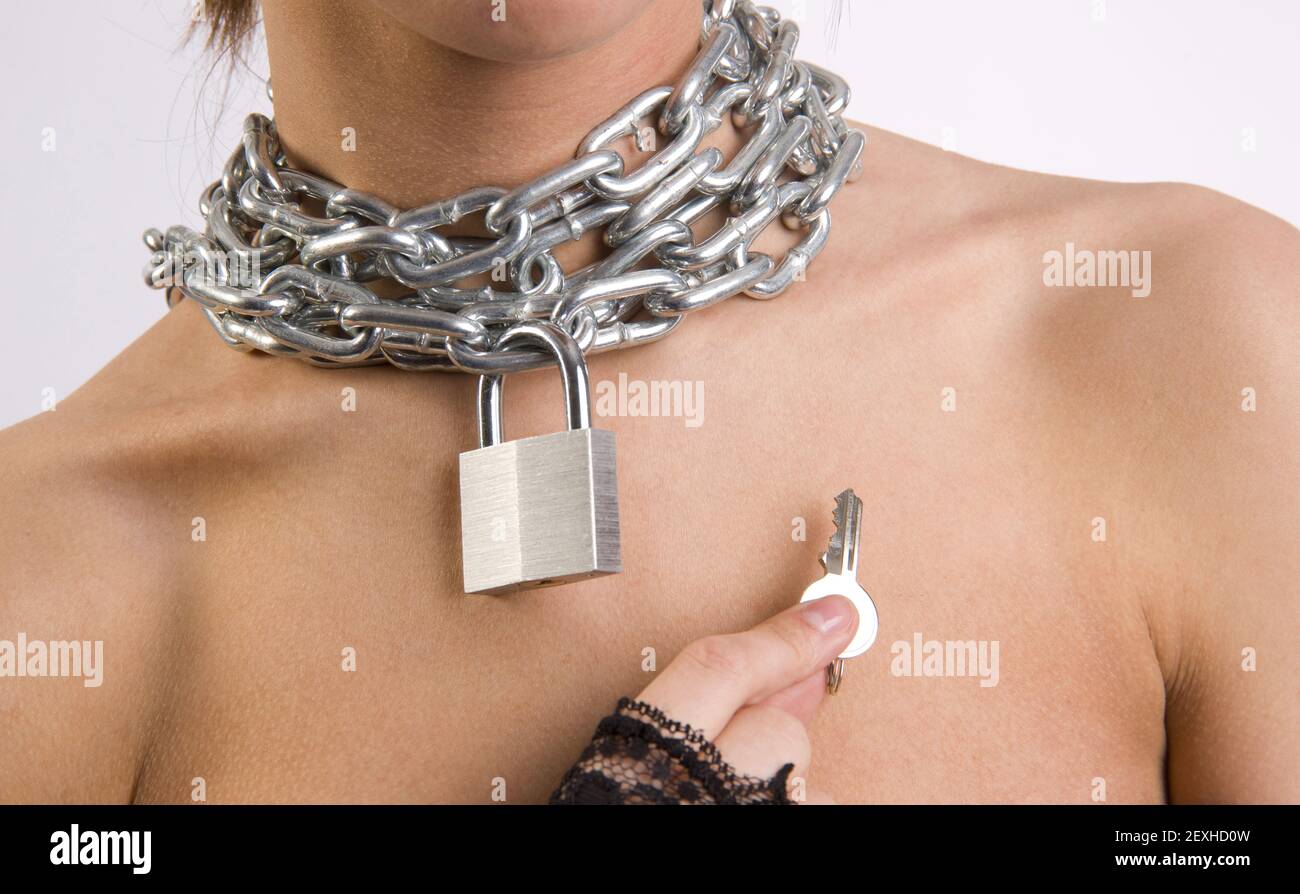 Chastity Chain Around Woman's Neck Padlock Key Stock Photo