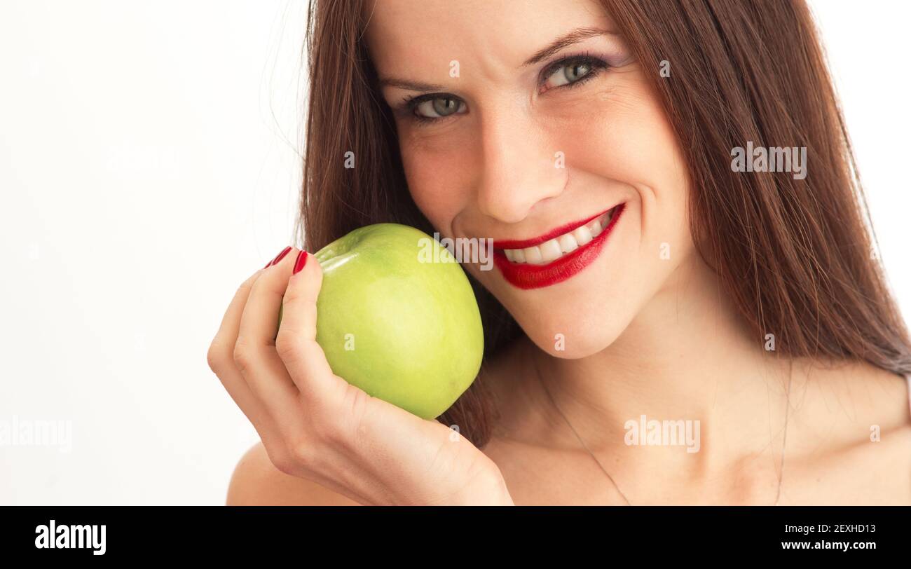 Green Granny Smith Apple Held Close to Attractive Woman Face Stock Photo