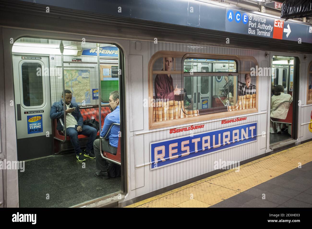 A Flushing line subway train in Times Square is wrapped in