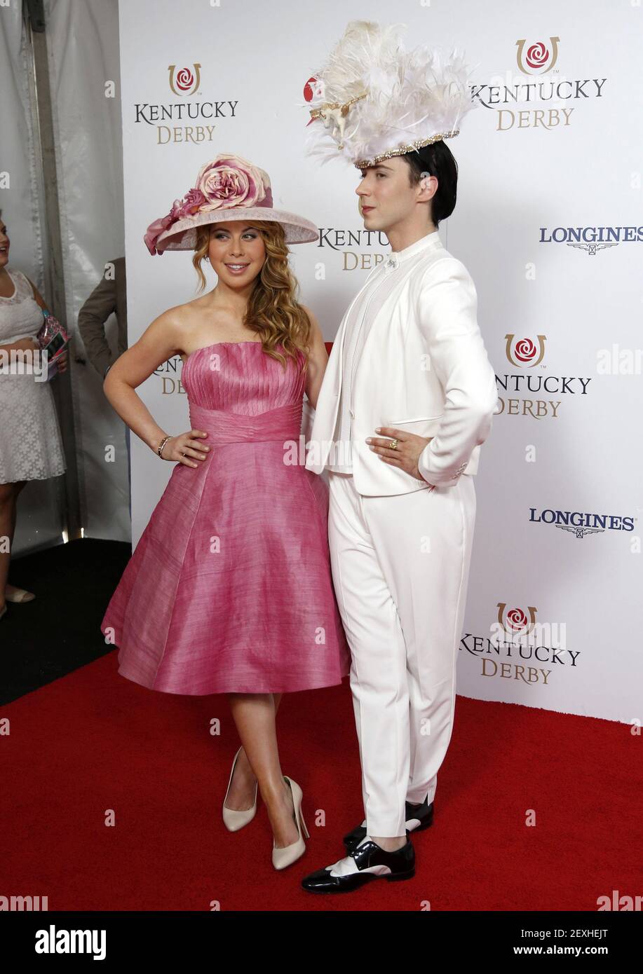 Former figure skating stars Tara Lipinski and Johnny Weir appear on the red carpet before the 140th running of the Kentucky Derby at Churchill Downs in Louisville, Ky., on May 3, 2014. (Photo by Amy Wallot/Lexington Herald-Leader/TNS/Sipa USA) Stock Photo