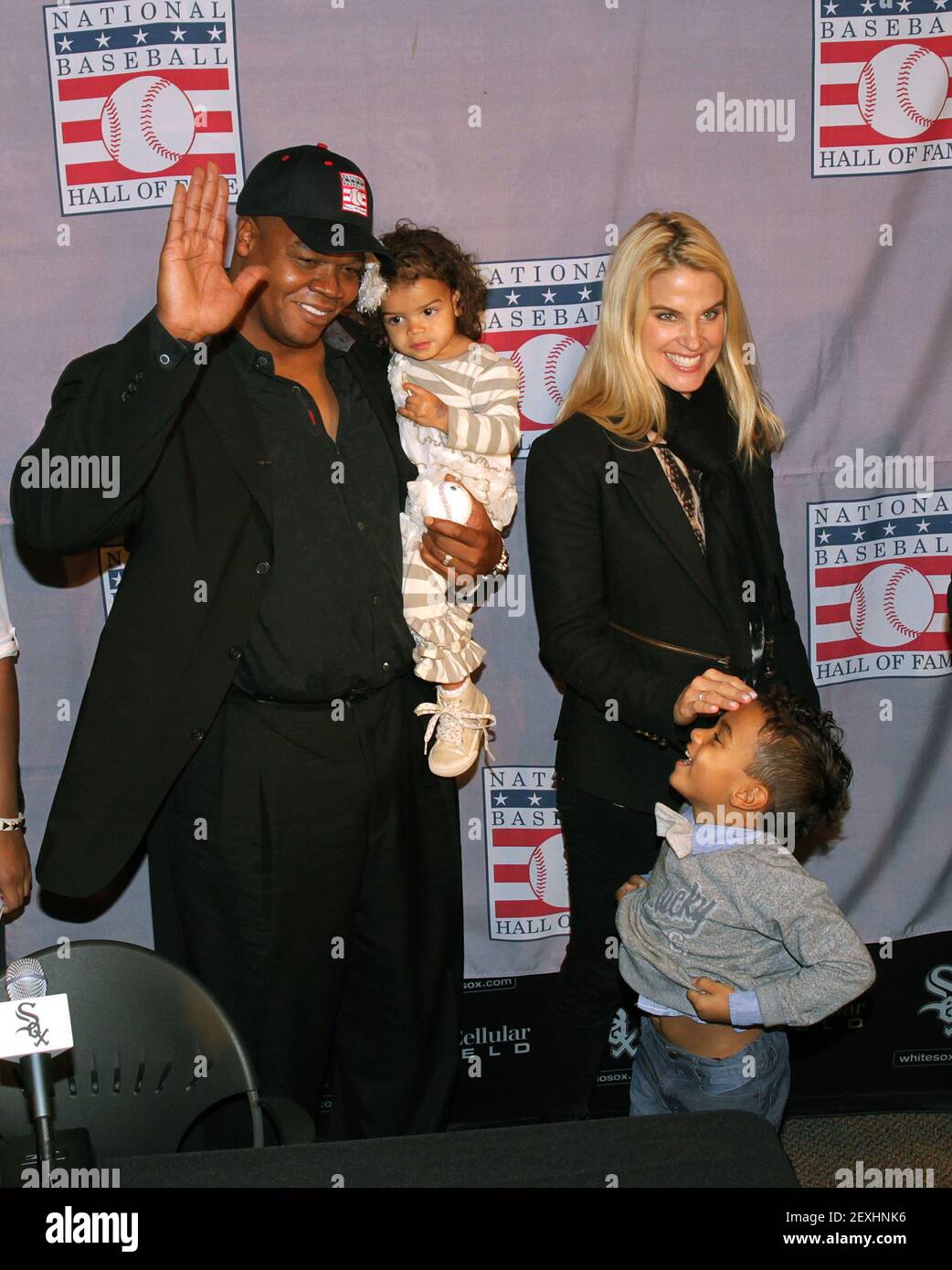 Frank Thomas arrives to a press conference with wife Meghan and kids  Ashley, being held, and Frank III, below, at U.S. Cellular Field in Chicago  on Wednesday, Jan. 8, 2014. Thomas was