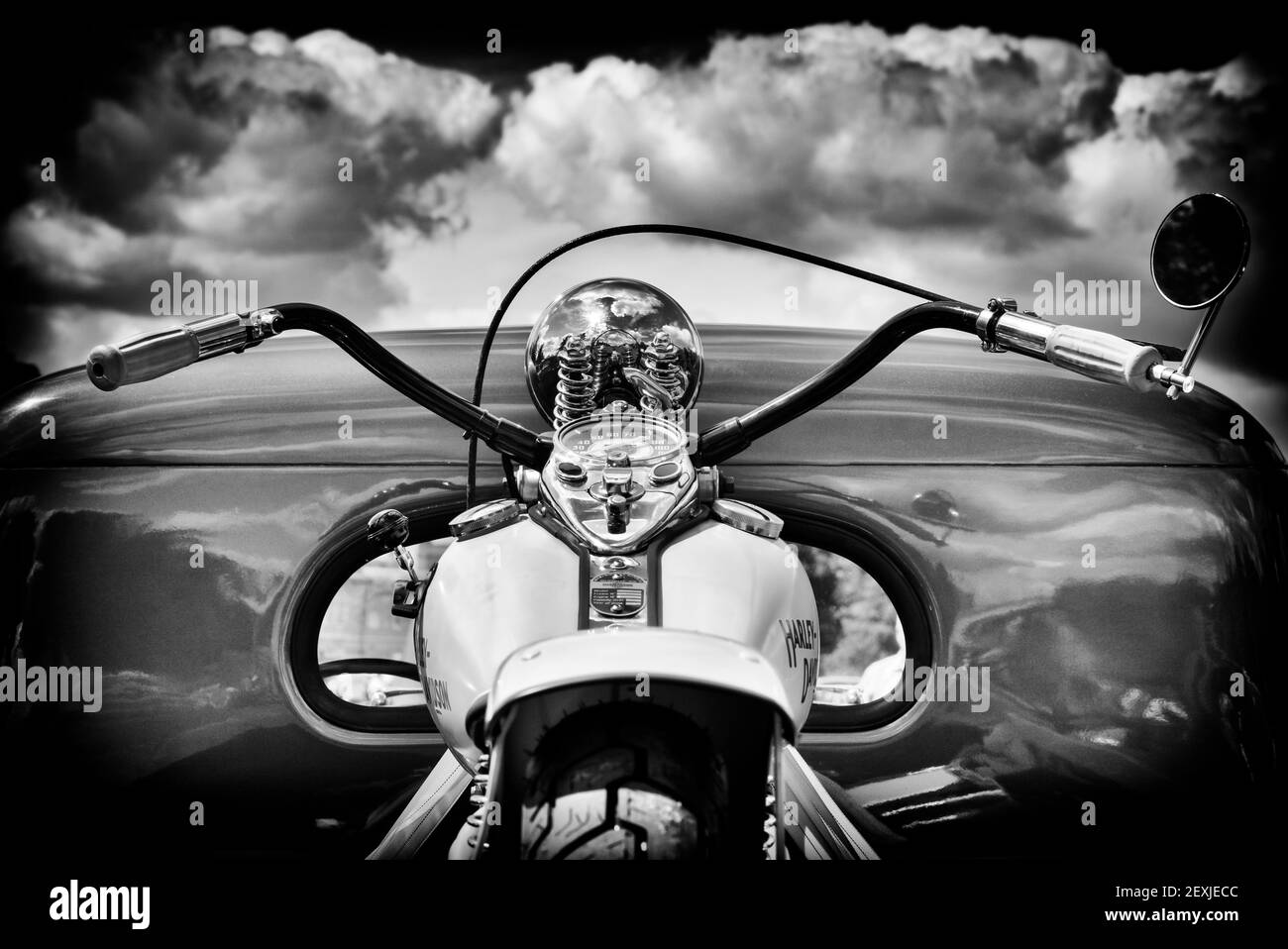 Vintage Harley Davidson Motorcycle on the back of an old chevrolet pick up truck. UK. Black and White Stock Photo