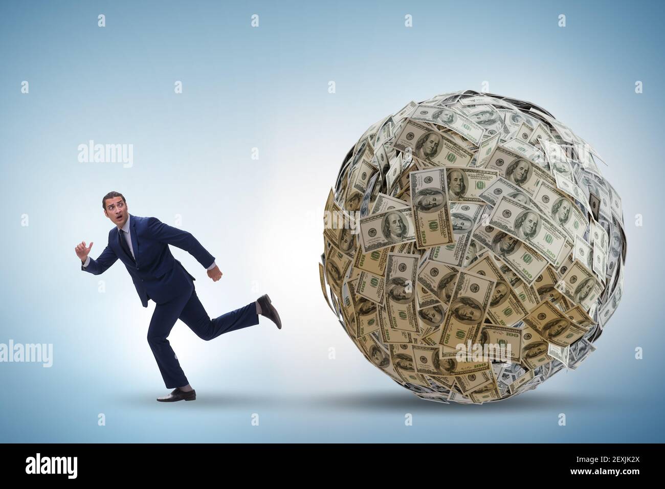 Businessman running away from the dollar ball Stock Photo - Alamy