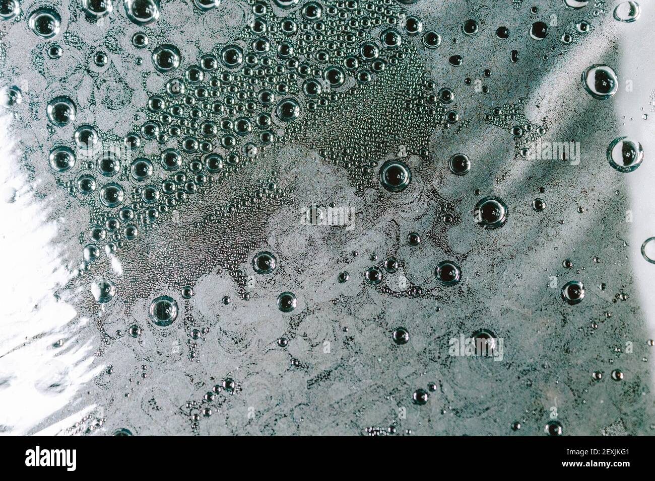 Water droplets on the film. Evaporation of moisture on a transparent