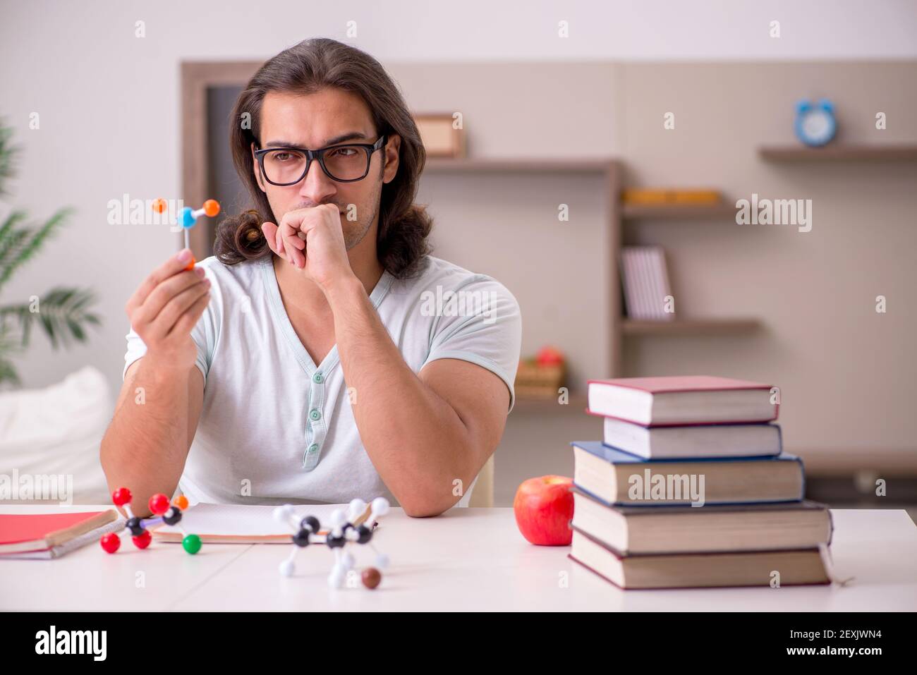 Young student preparing for exams at home Stock Photo - Alamy