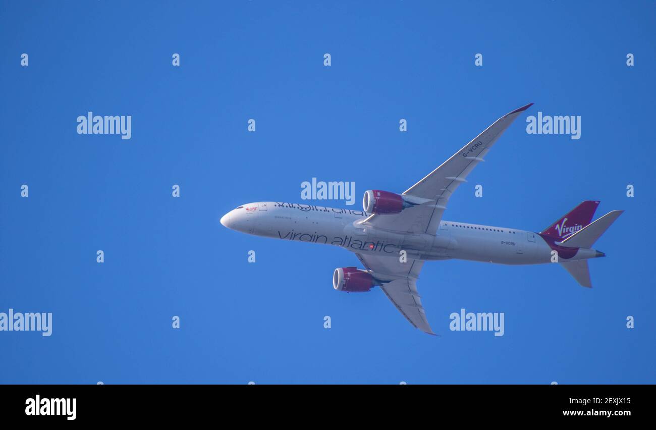 Johannesburg, South Africa - a Virgin Atlantic Airlines flight isolated in the sky above the city image with copy space in horizontal format Stock Photo