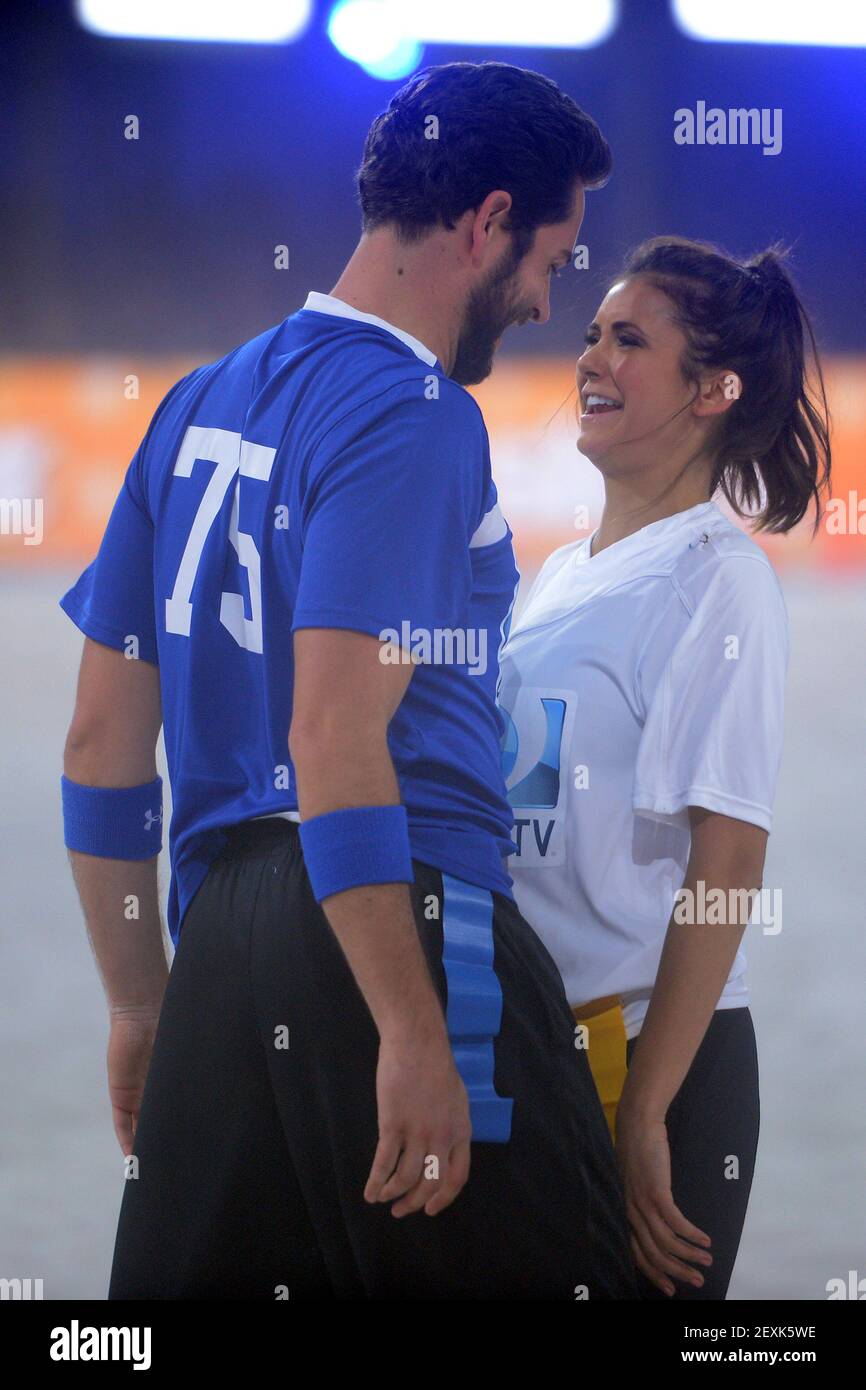 L-R) Zachary Levi and Nina Dobrev participates in the 8th Annual DirecTV  Beach Bowl Celebrities vs. NFL Greats at Pier 40 in New York, NY, on  February 1, 2014(Photo by Anthony Behar/Sipa
