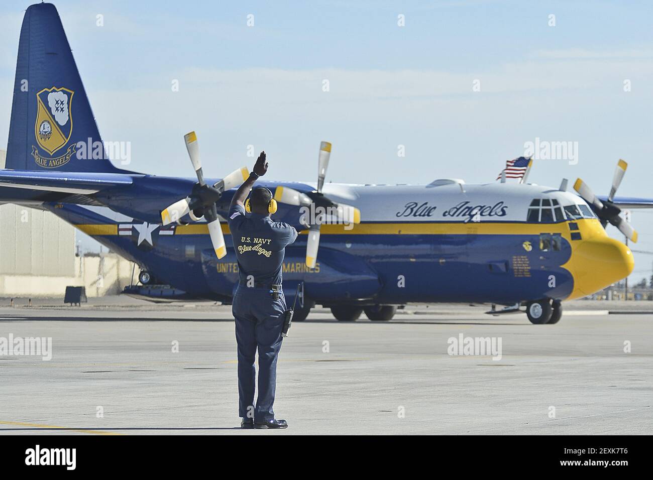 U.S. Navy Aviation Ordnanceman 1st Class Eli Lang, a crew chief assigned to the Blue Angels flight demonstration team, directs a C-130 Hercules aircraft as it arrives at Naval Air Facility El Centro, Calif., Jan. 23, 2014, in preparation for the 2014 show season. (Photo by Mass Communication Specialist 2nd Class Kathryn E. Macdonald, U.S. Navy/DoD/Sipa USA) Stock Photo