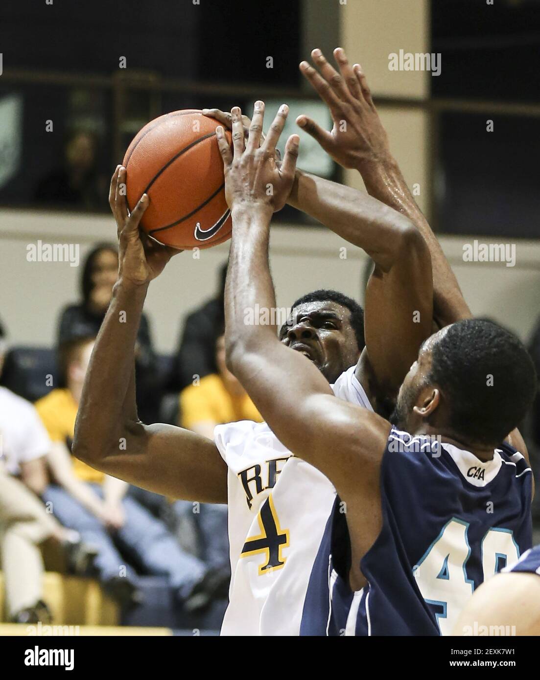 Drexel Dragons' Frantz Massenat is fouled by UNC Wilmington Seahawks'  Cedrick Williams during the 2nd half at The Daskalakis Athletic Center in  Philadelphia on Monday, Feb. 3, 2014. (Photo by Steven M.