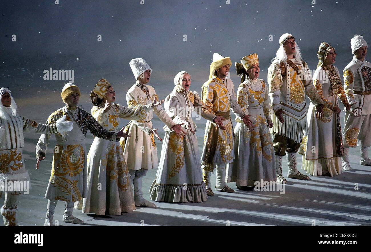 Performers in traditional Russian costumes perform during the Opening