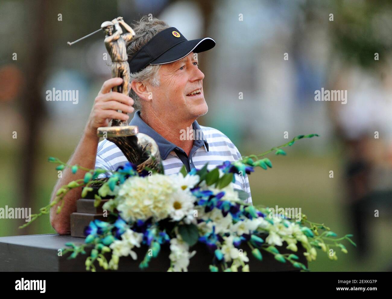 Michael Allen hoists the trophy for winning the Allianz Championship at ...