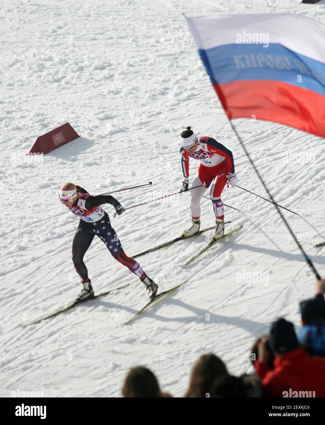 Kikkan Randall, of Anchorage, Alaska, struggles to fight off Marit Bjoergen, of Norway, before the final turn of the women's sprint quarterfinal at the Laura Nordic Center in Krasnaya Polyana, Russia, on Tuesday, Feb. 11, 2014. Randall would falter down the stretch and finish fourth in her group, missing the semifinals. (Photo by Tom Peterson/MCT/Sipa USA) Stock Photo