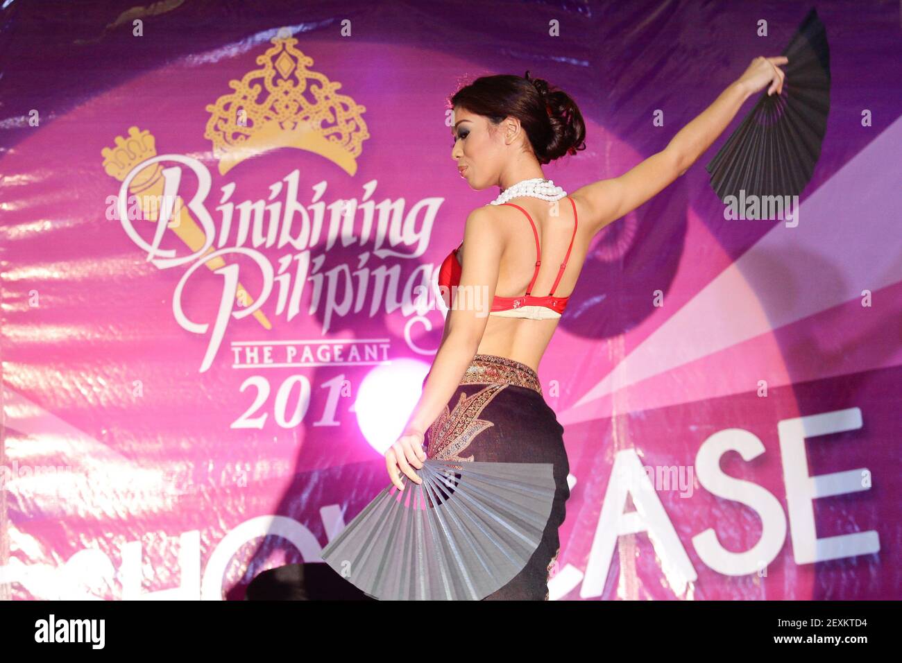 Quezon City, Philippines - A beauty pageant candidate performs an ethnic dance during the talent show portion of the Binibining Pilipinas 2014 held on Valentine's Day. The winners of the competition will represent the Philippines in different international beaty pageant contests. (Photo by Mark Cristino/Pacific Press/Sipa USA) Stock Photo