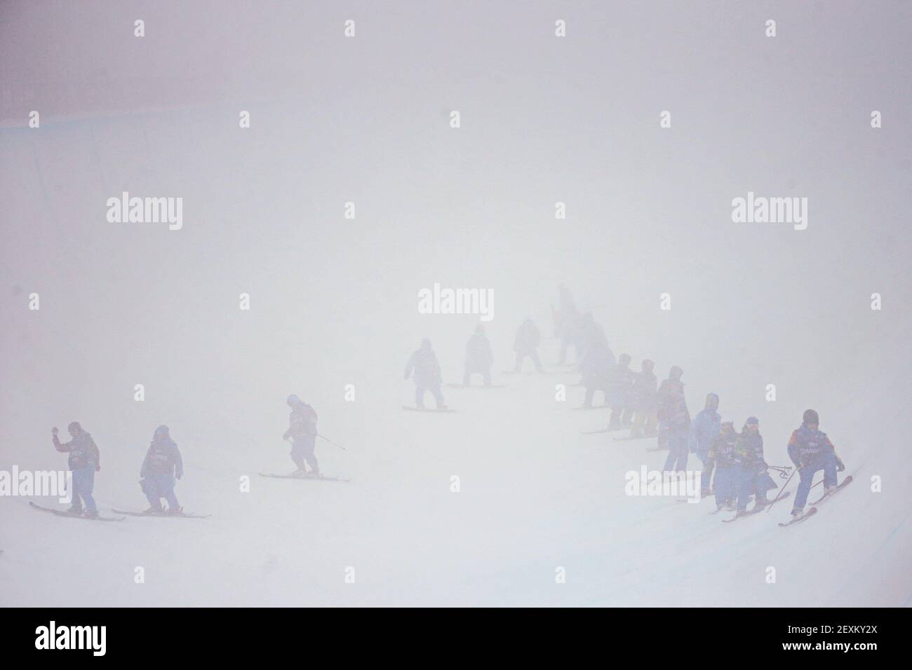 Slippers prepare the halfpipe in snow and fog for the finals of the men's ski halfpipe at Rosa Khutor Extreme Park during the Winter Olympics in Sochi, Russia, Tuesday, Feb. 18, 2014. (Photo by Brian Cassella/Chicago Tribune/MCT/Sipa USA) Stock Photo