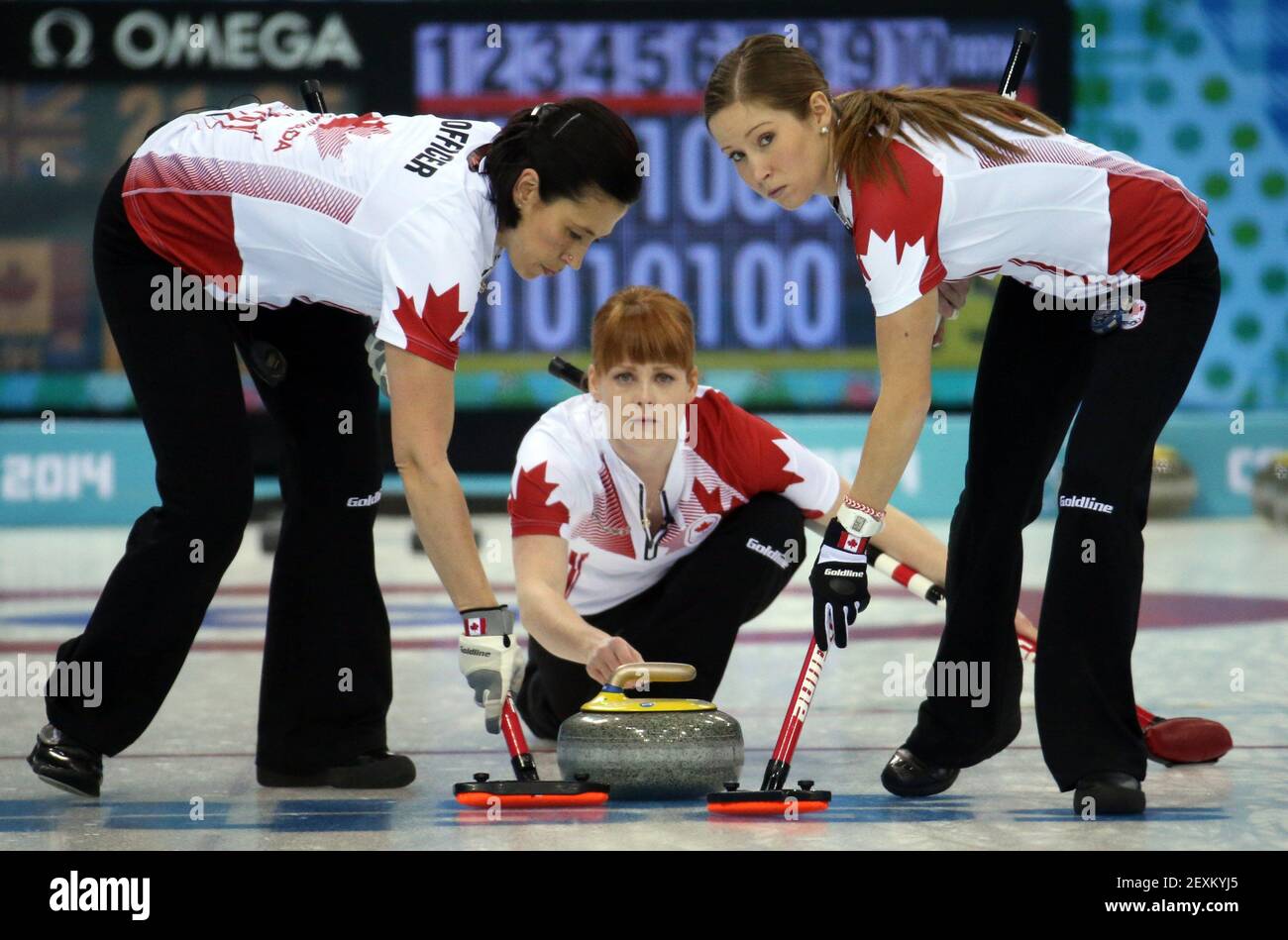 Canada's Jill Officer (left to right), Dawn McEwen and Kaitlyn Lawes throw during their victory over Great Britain in the women's curling semifinals at the Ice Cube Curling Center during the Winter Olympics in Sochi, Russia, Wednesday, Feb. 19, 2014. (Photo by Brian Cassella/Chicago Tribune/MCT/Sipa USA) Stock Photo