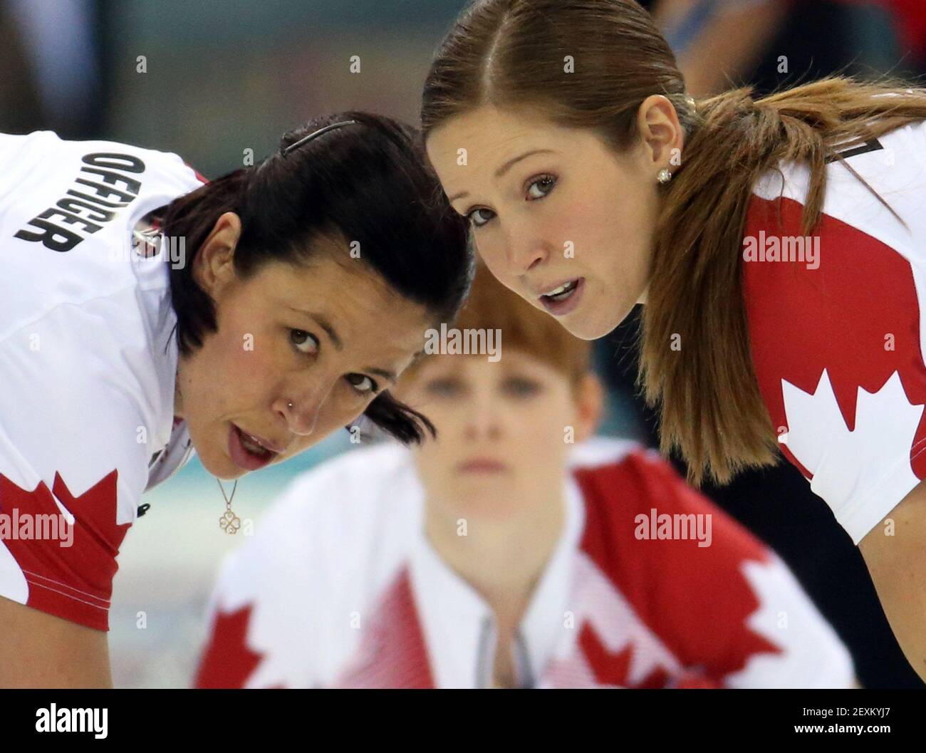 Canada's Jill Officer (left to right), Dawn McEwen and Kaitlyn Lawes watch a throw during their victory over Great Britain in the women's curling semifinals at the Ice Cube Curling Center during the Winter Olympics in Sochi, Russia, Wednesday, Feb. 19, 2014. (Photo by Brian Cassella/Chicago Tribune/MCT/Sipa USA) Stock Photo