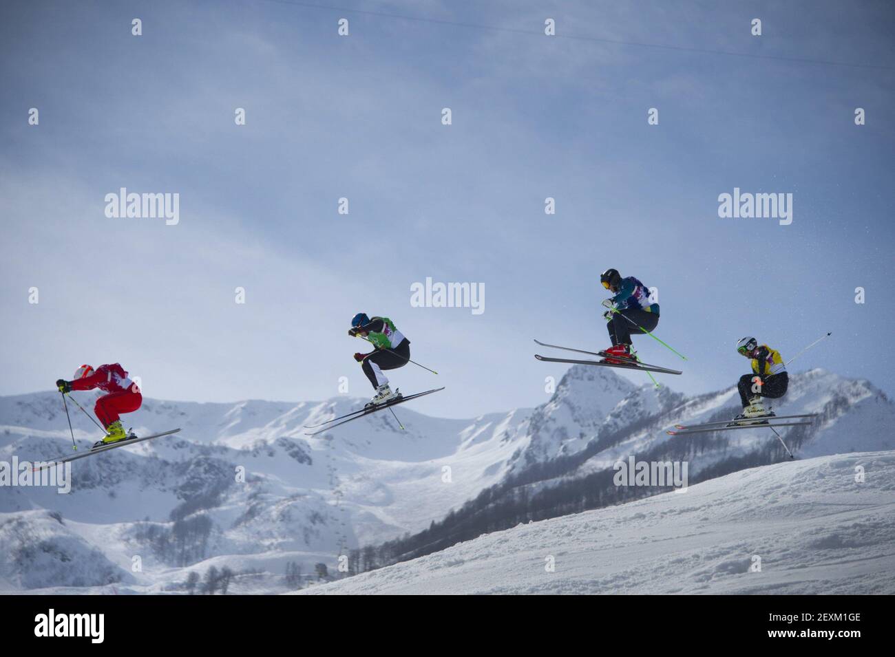 Left to right, Armin Niederer of Switzerland, Jouni Pellinen of Finland, Scott Kneller of Australia and Thomas Borge Lie of Norway clear a jump during the men's ski cross at the Winter Olympics in Sochi, Russia, on Thursday, Feb. 20, 2014. (Photo by Mark Reis/Colorado Springs Gazette/MCT/Sipa USA) Stock Photo