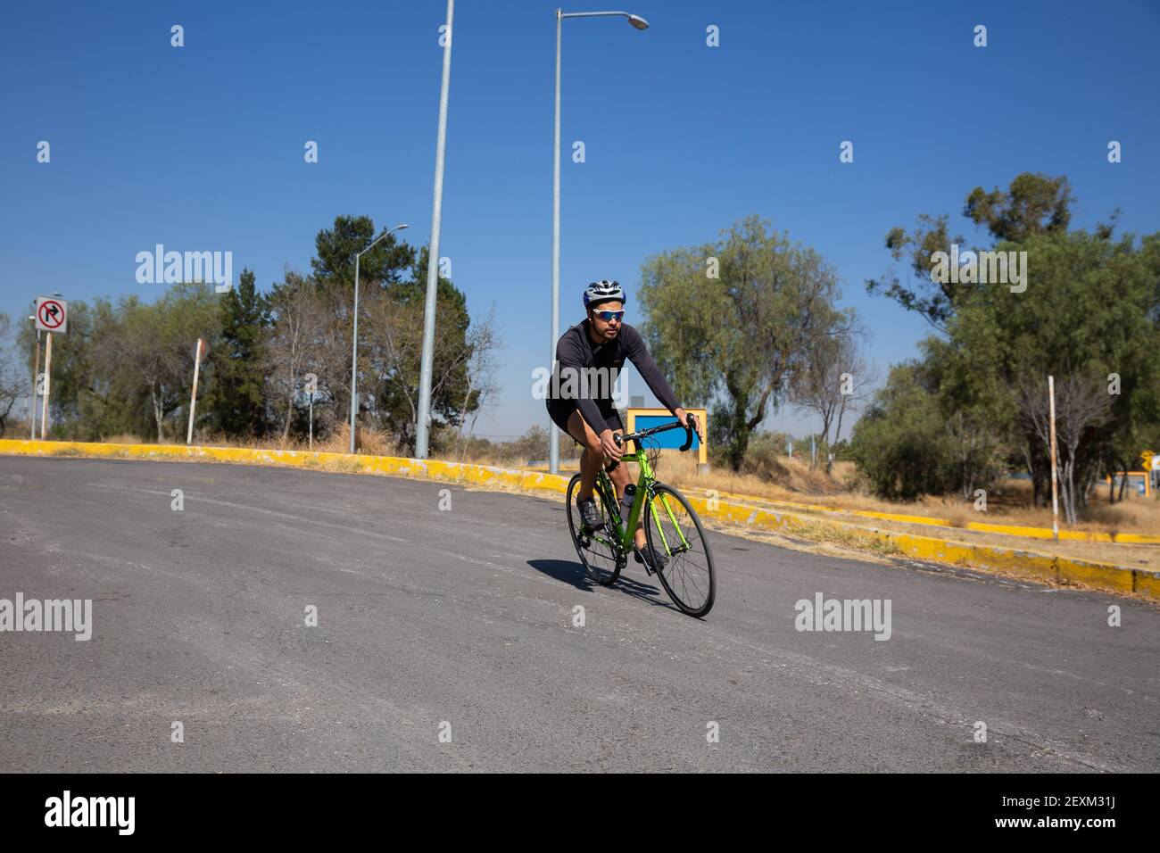 Hispanic Man Riding Bike Hispanic man in sports hi-res stock photography and images - Alamy