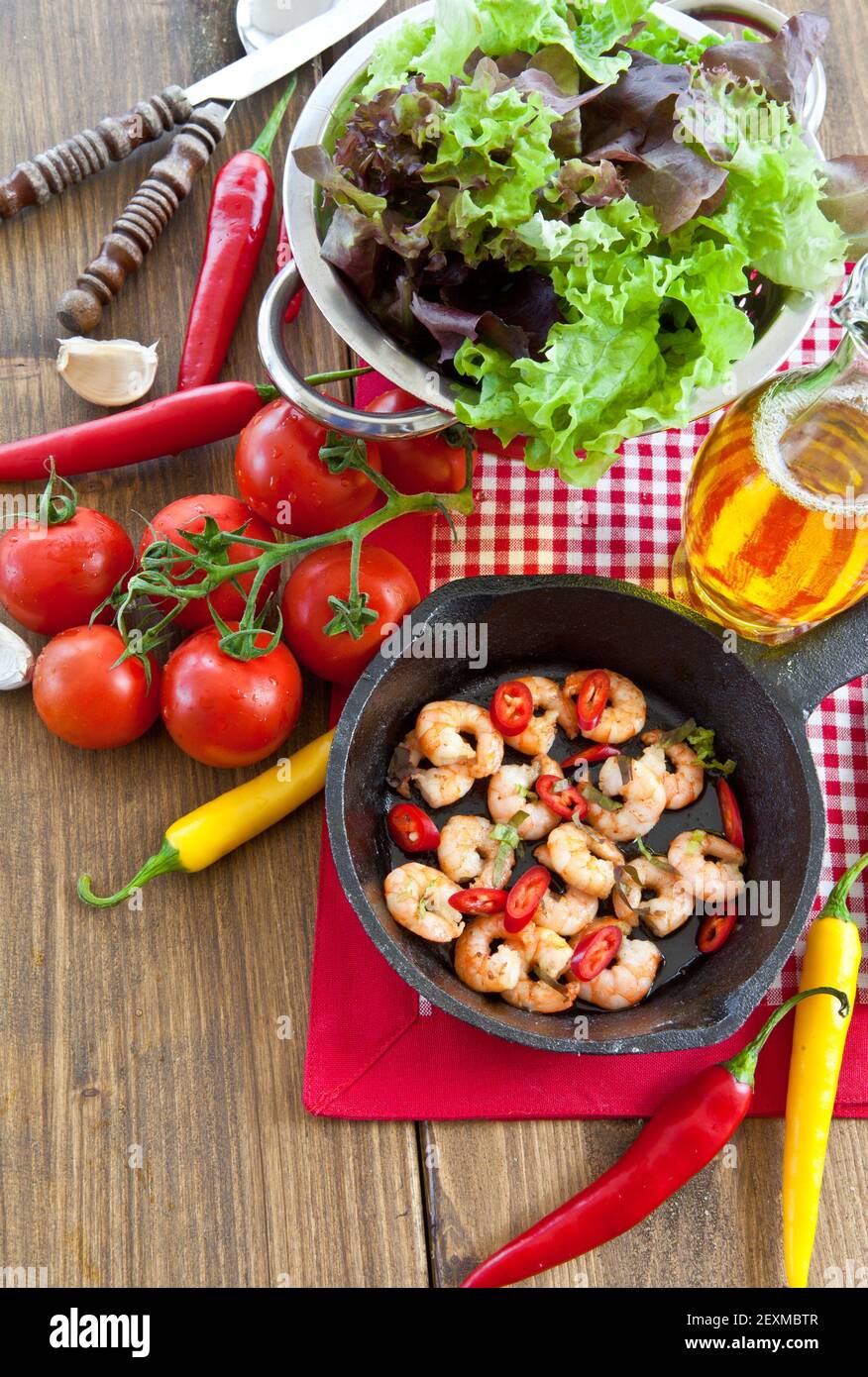 Garlic prawns in cast iron pan Stock Photo Alamy