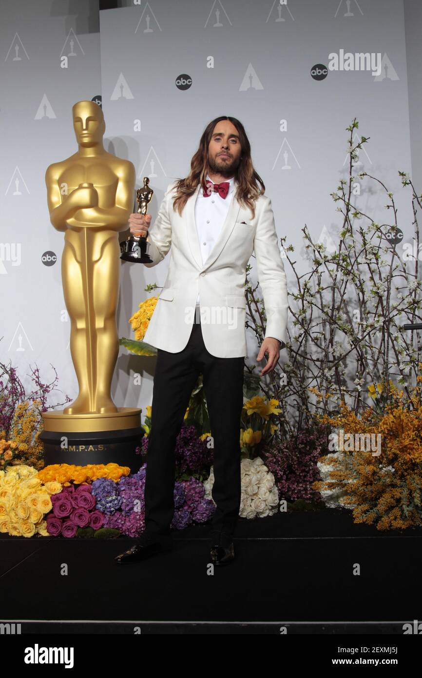 Jared Leto wins best supporting actor Oscar at the 86th Academy Awards for  his role in Dallas Buyers Club. Leto appears with actress Anne Hathaway who  presented him with the award. (Photo