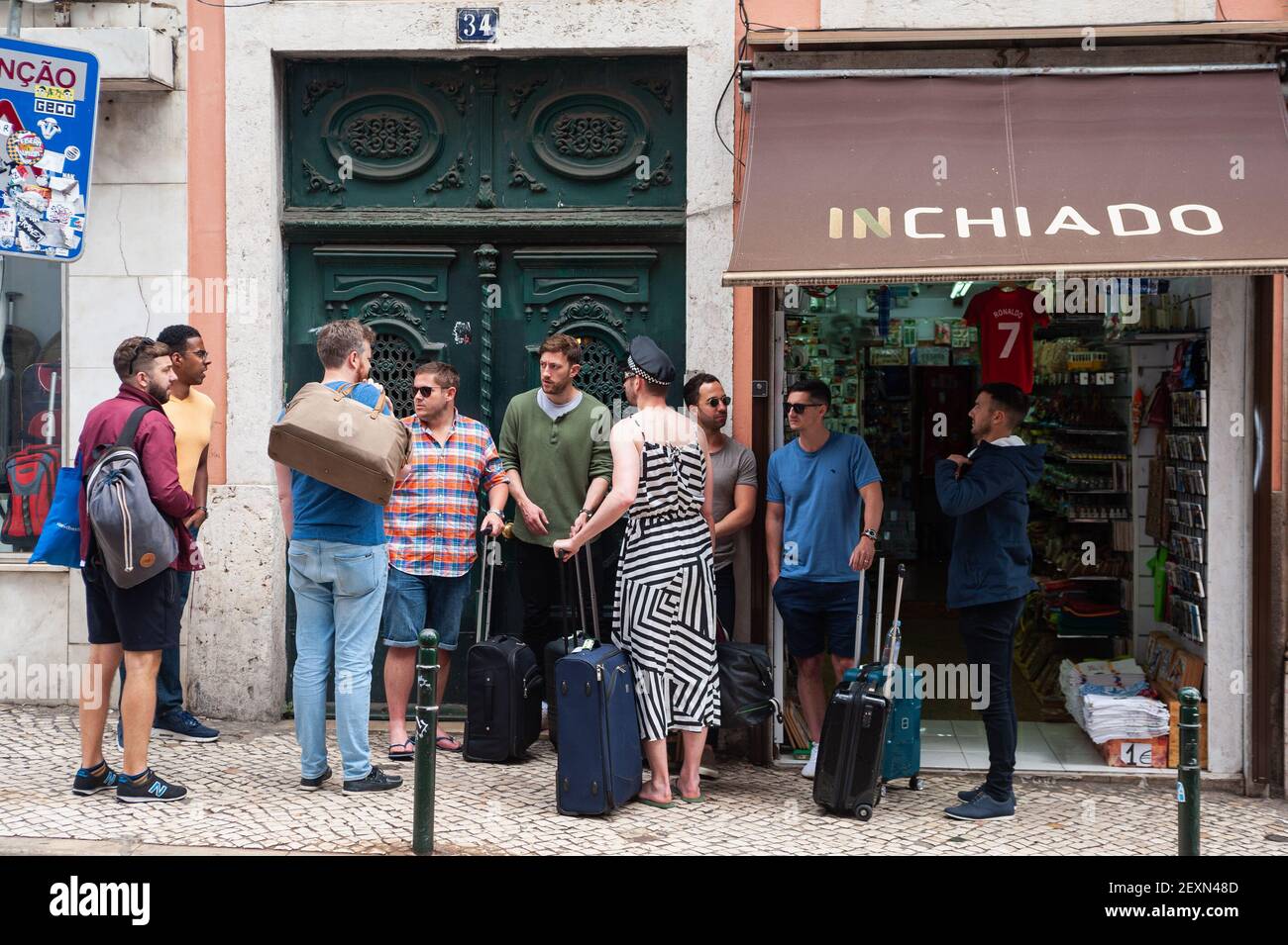 11.06.2018, Lisbon, Portugal, Europe - Group of male tourists with suitcases visits the old town of the Portuguese capital city for a stag party. Stock Photo
