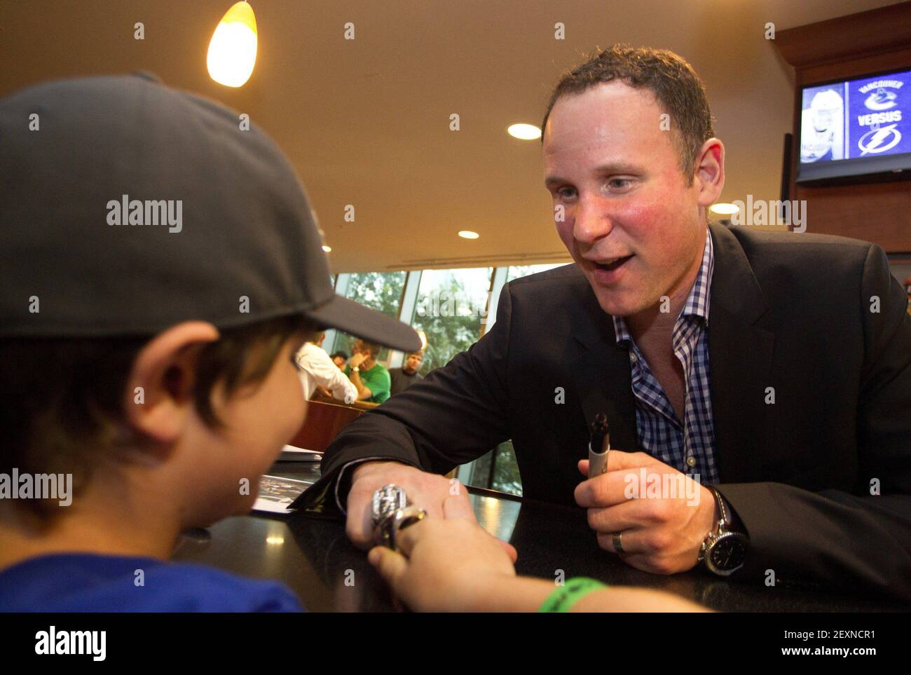 https://c8.alamy.com/comp/2EXNCR1/tampa-bay-lightning-stanley-cup-winner-nolan-pratt-compares-his-championship-ring-with-the-replica-stanley-cup-ring-worn-by-nathan-feltmate-10-at-the-tampa-bay-times-forum-in-tampa-fla-on-monday-march-17-2014-the-tampa-bay-lightning-faced-the-vancouver-canucks-photo-by-dirk-shaddtampa-bay-timesmctsipa-usa-2EXNCR1.jpg