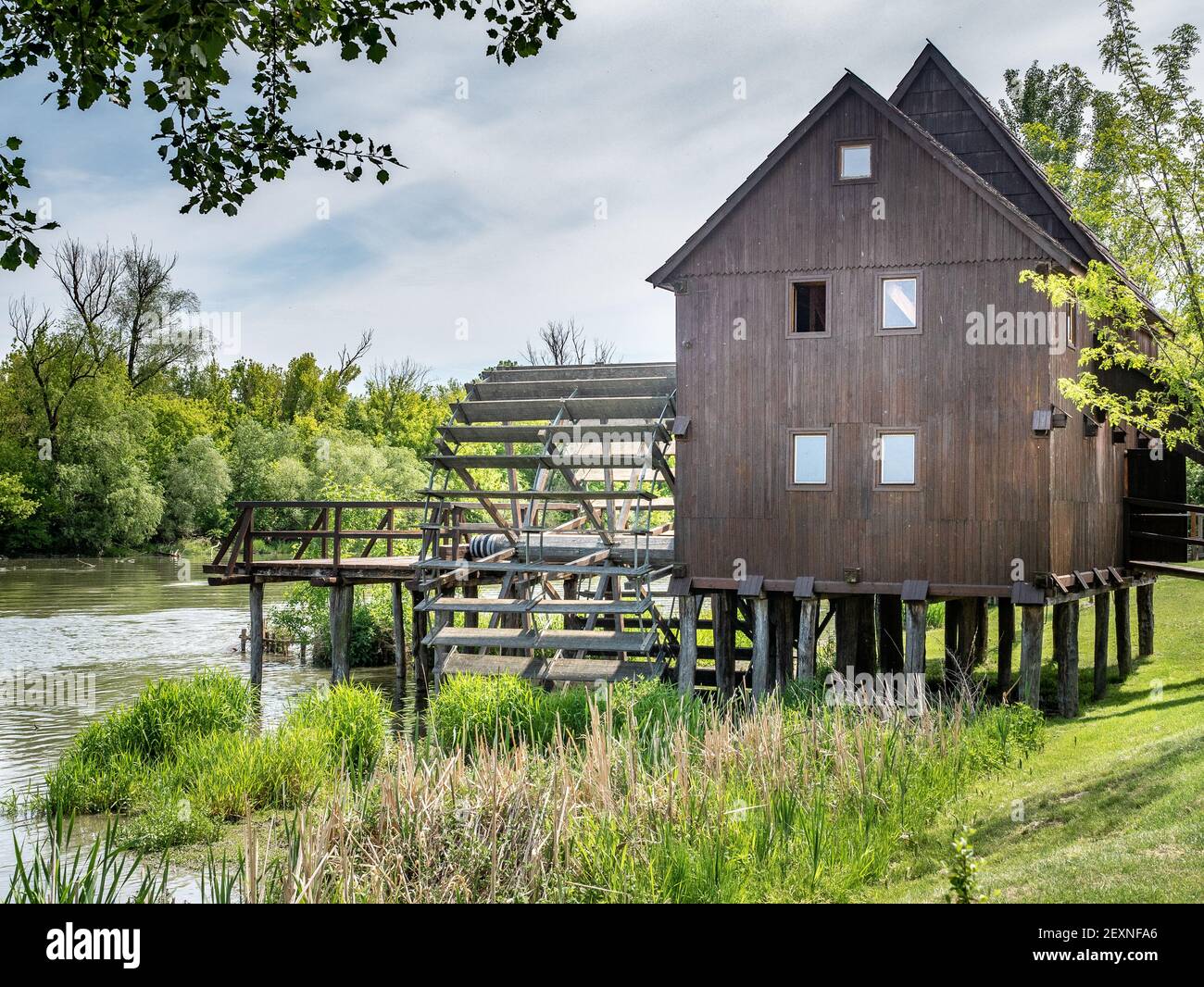 JELKA, SLOVAKIA - May 9, 2020 - Close up of historical wooden Watermill on Little Danube at summer day. Museum and technical monument.  Stock Photo