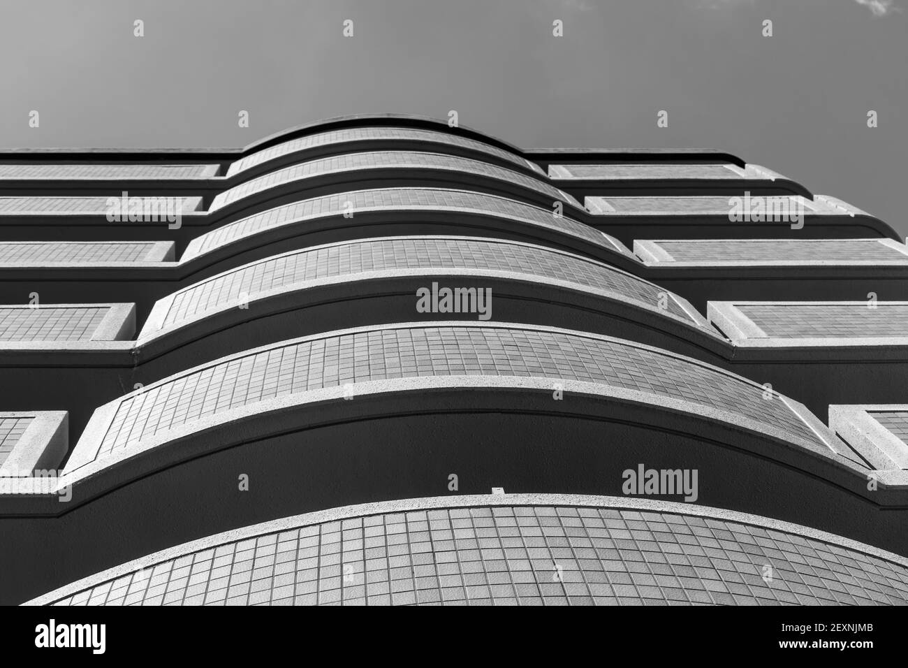 Rounded balconies of an apartment building create their own fish eye perspective. Stock Photo