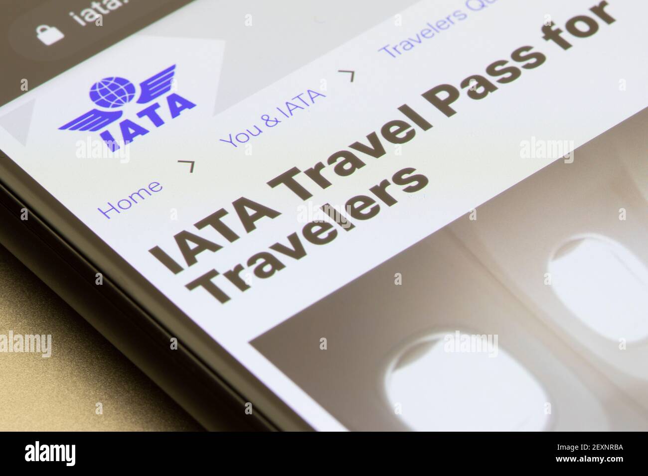 The IATA Travel Pass introduction page is seen on the IATA website on a phone on March 6, 2021. IATA plans to launch a travel pass app soon. Stock Photo