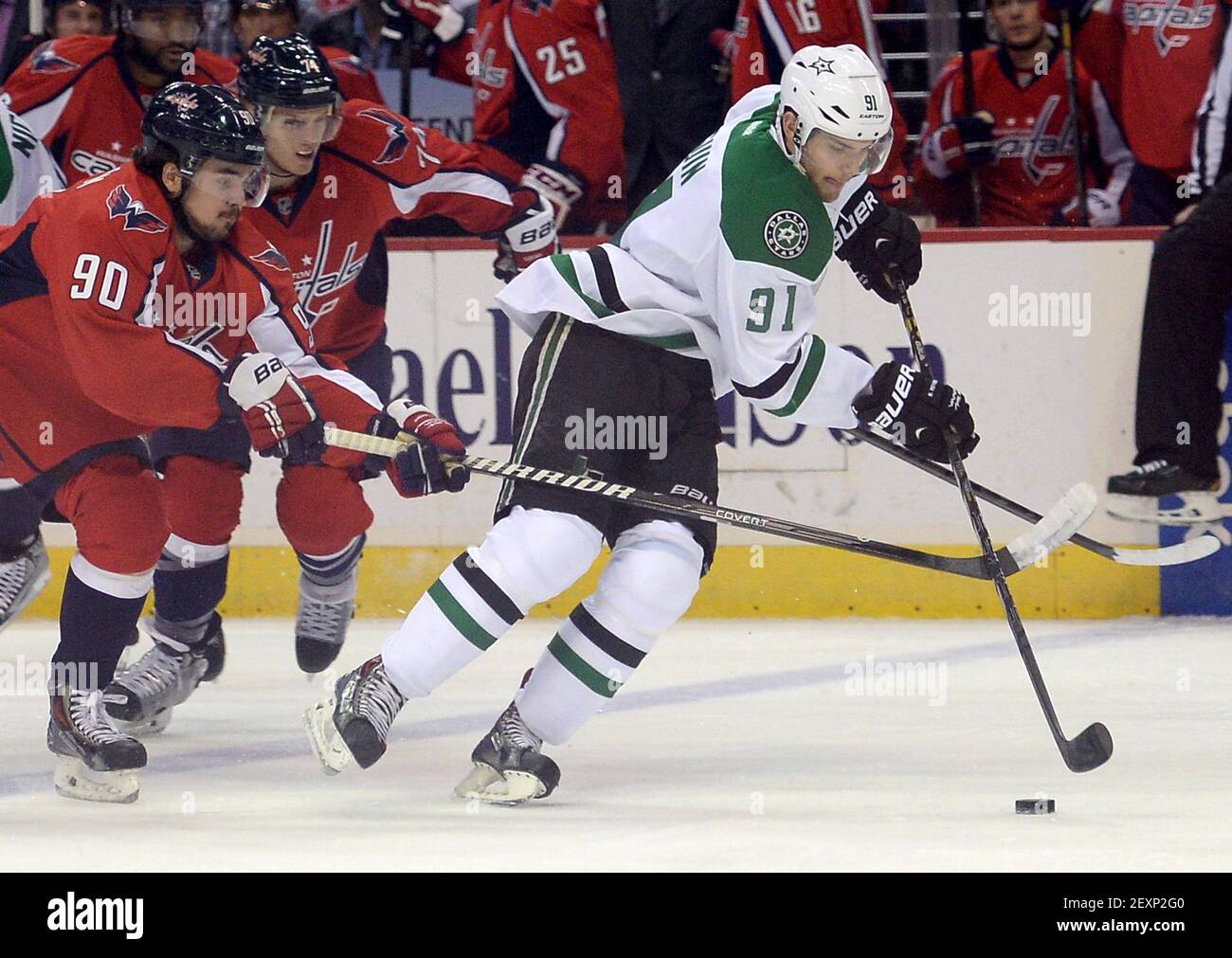 Dallas Stars center Tyler Seguin controls the puck in front of Minnesota  Wild's Marcus Johansson (90) during Game 1 of an NHL hockey Stanley Cup  first-round playoff series, Tuesday, April 18, 2023