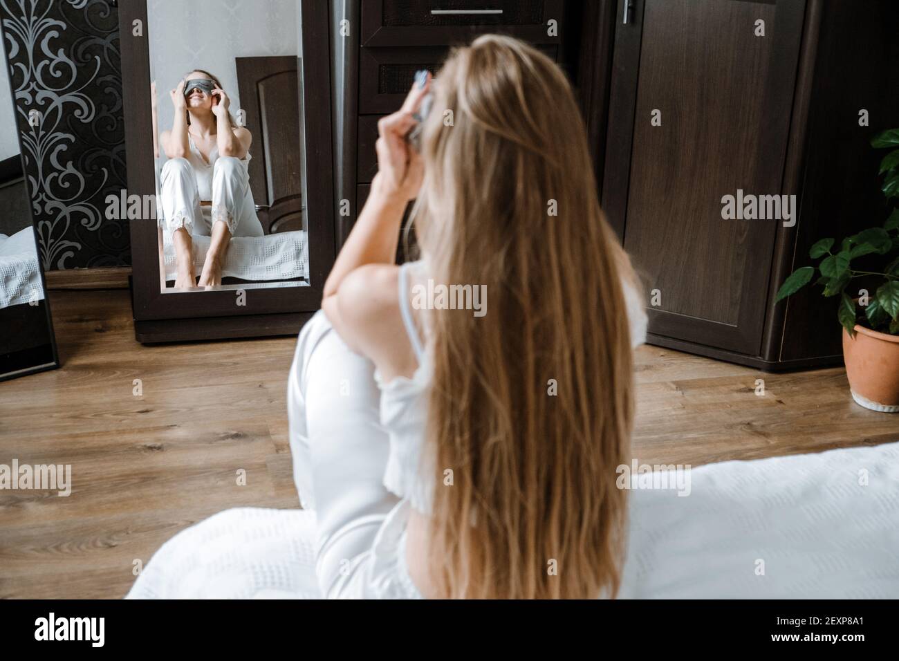 Self care, Mental health, mental wellbeing, calm, mourning routine, start day. No stress, healthy habit, concept. Young woman in pajamas doing morning Stock Photo