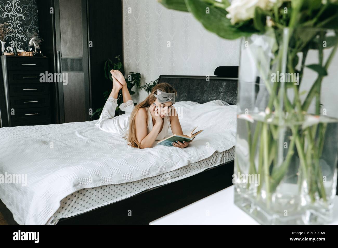 Self care, Mental health, mental wellbeing, calm, mourning routine, start day. No stress, healthy habit, concept. Young woman in pajamas doing morning Stock Photo