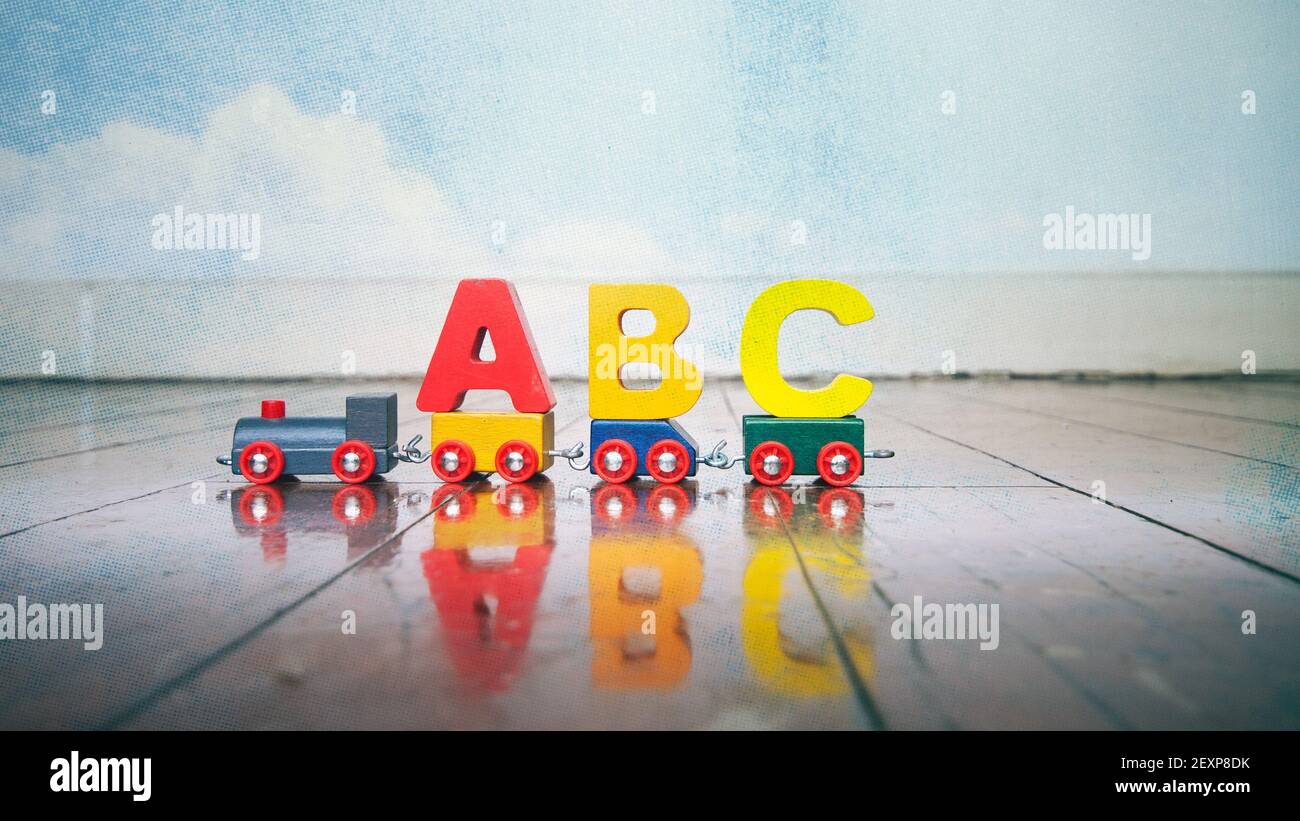 Abc toy train on a old wooden floor Stock Photo - Alamy