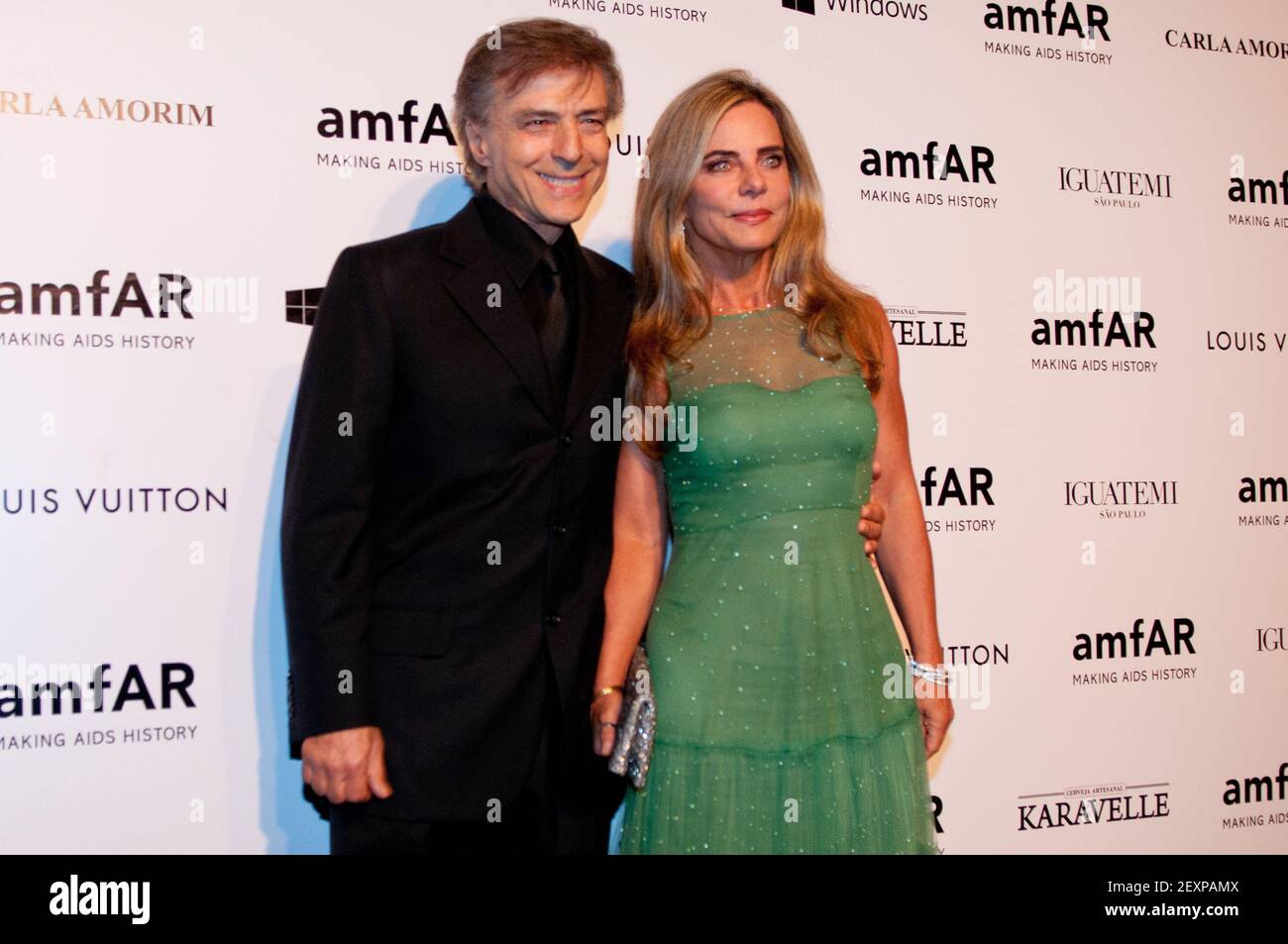 Brazilian actor Carlos Alberto Riccelli (L) and former Brazilian super  model Bruna Lombardi (R) arriving at the AmfAR Inspiration Gala benefits  against AIDS in Sao Paulo, Brazil, on April 4, 2014. Photo