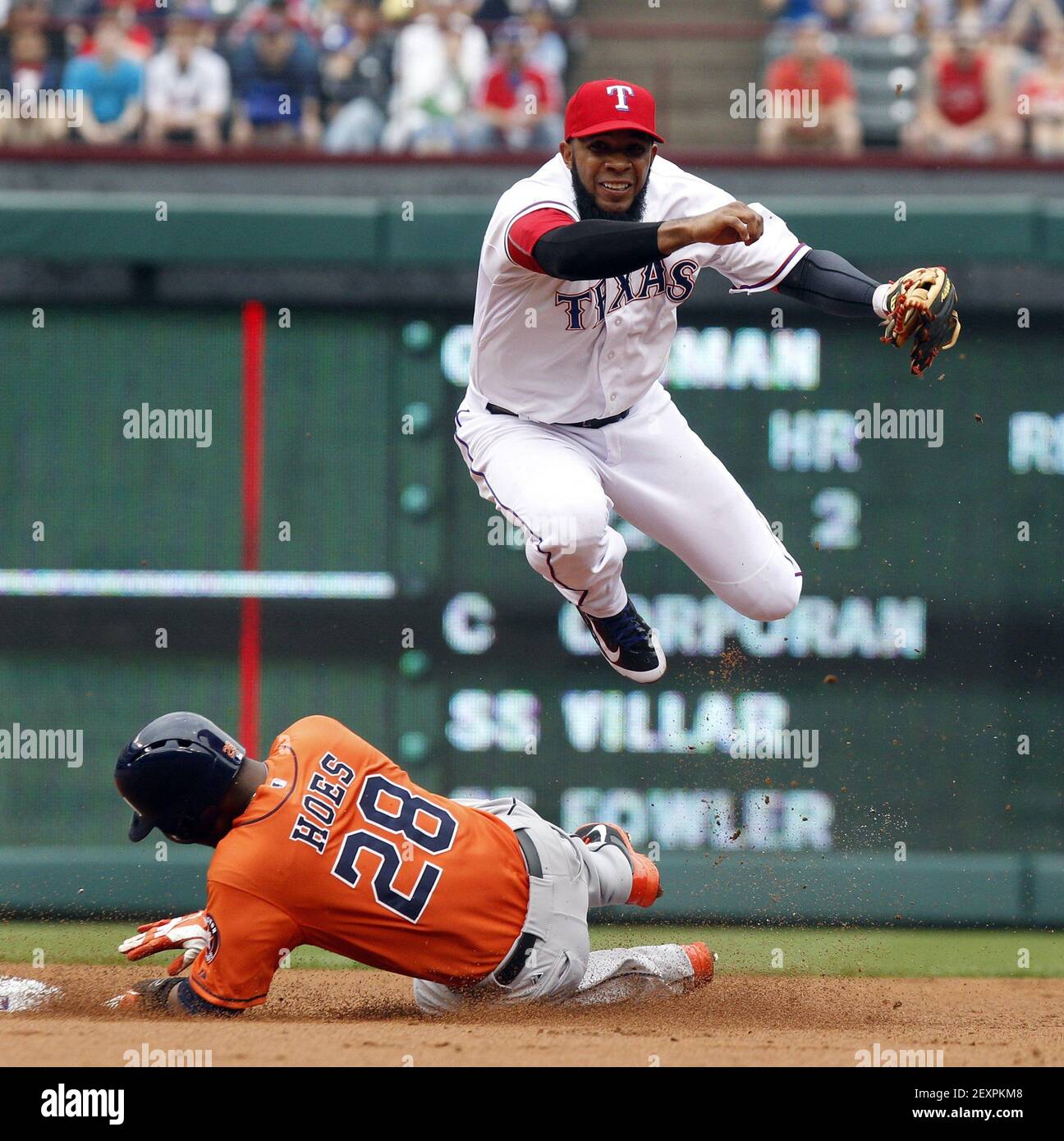 Texas Rangers shortstop Elvis Andrus (1) leaps over Houston Astros