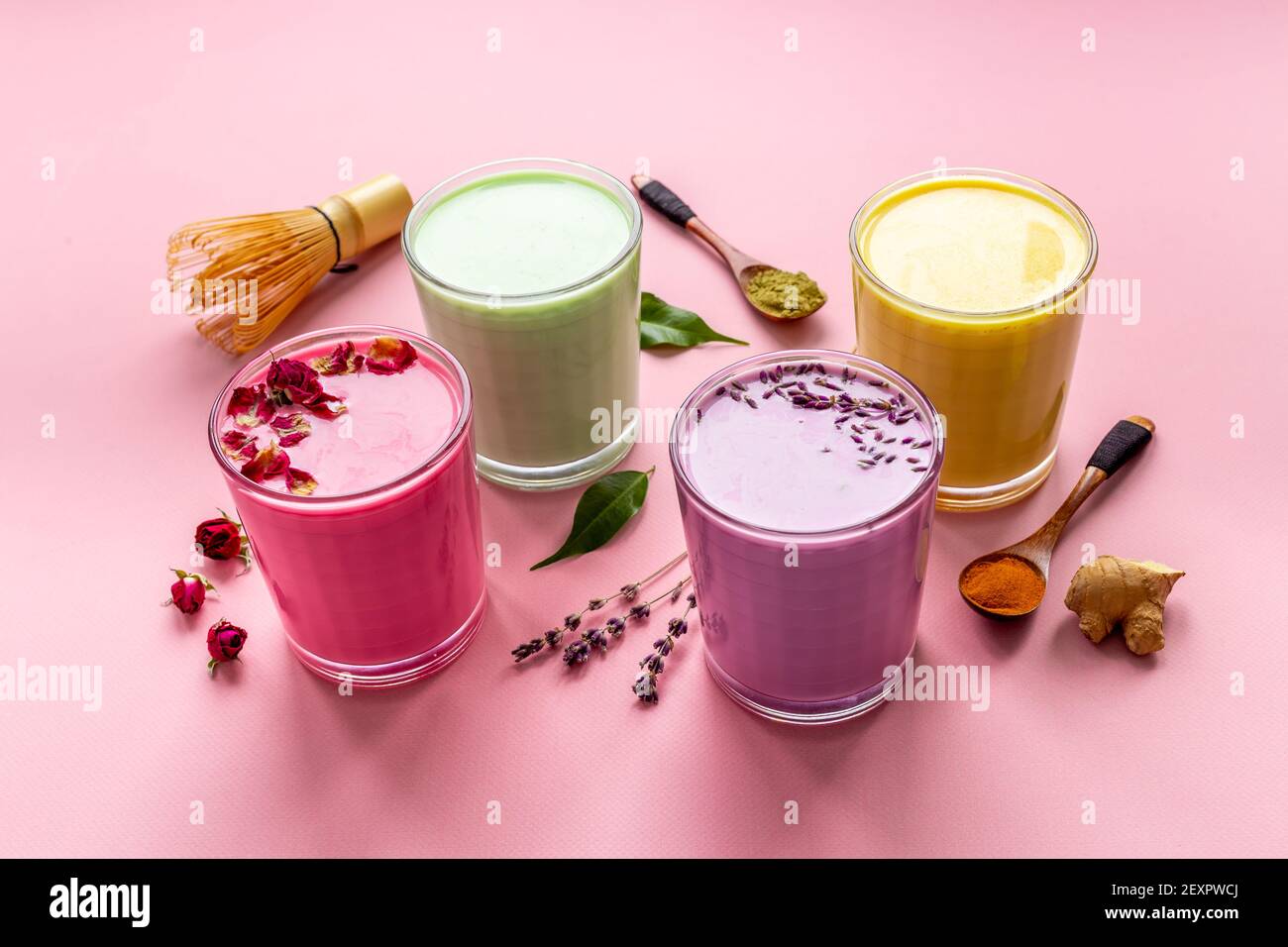 Green, yellow and pink latte. Hot colorful coffee or tea with milk