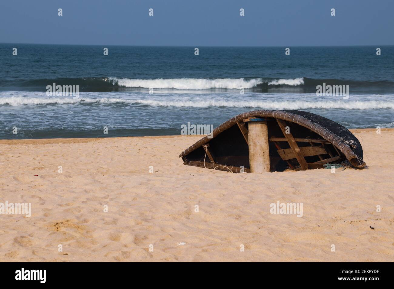 An old Vietnamese wooden boat on a sandy shore Stock Photo - Alamy