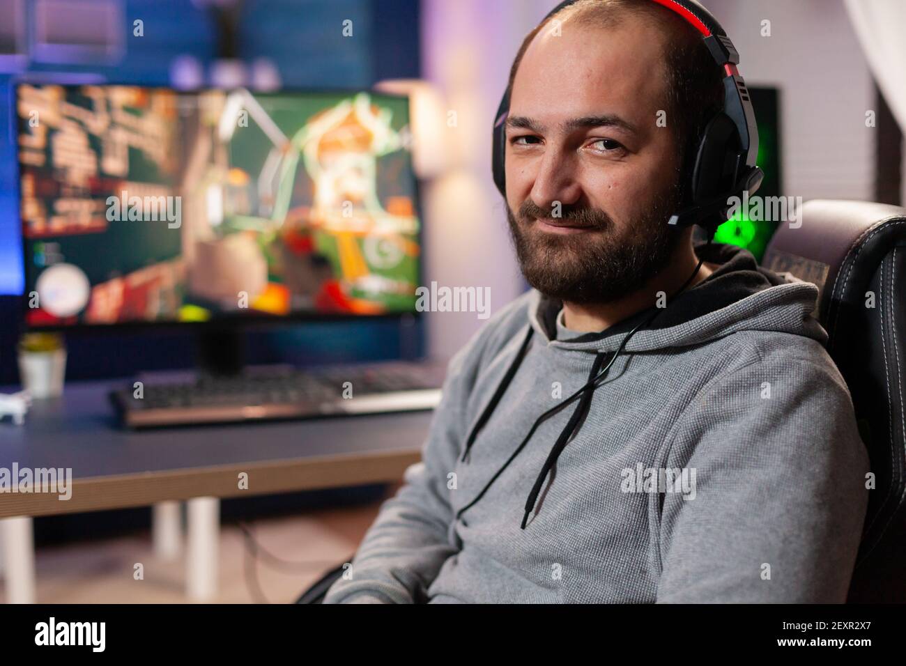 Videogamer looking into powerful computer playing virtual shooter game late  at night in living room. Online streaming cyber performing during gaming  tournament using technology network wireless Stock Photo - Alamy