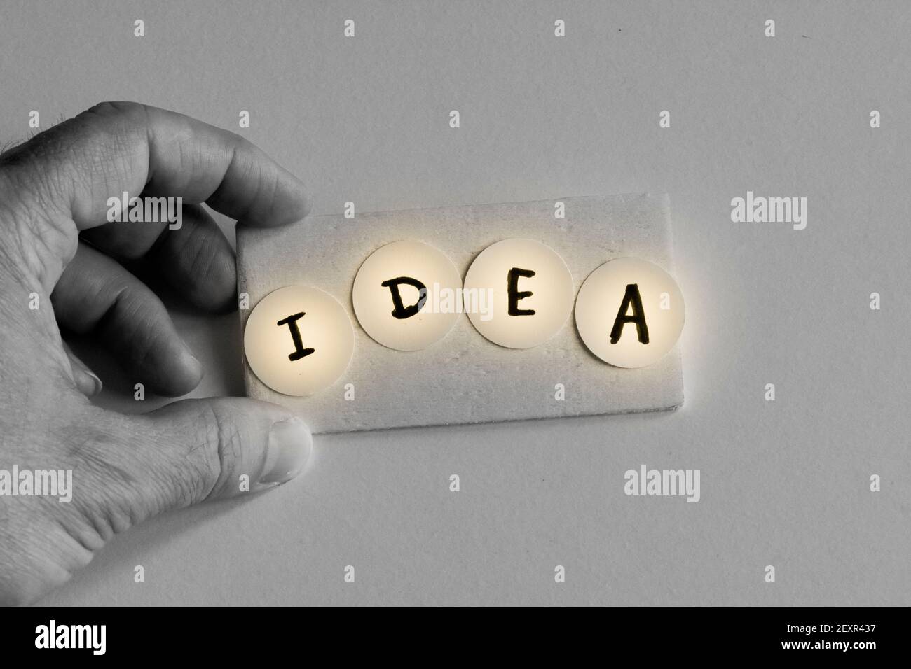 Detail of a hand holding word idea. Stock Photo